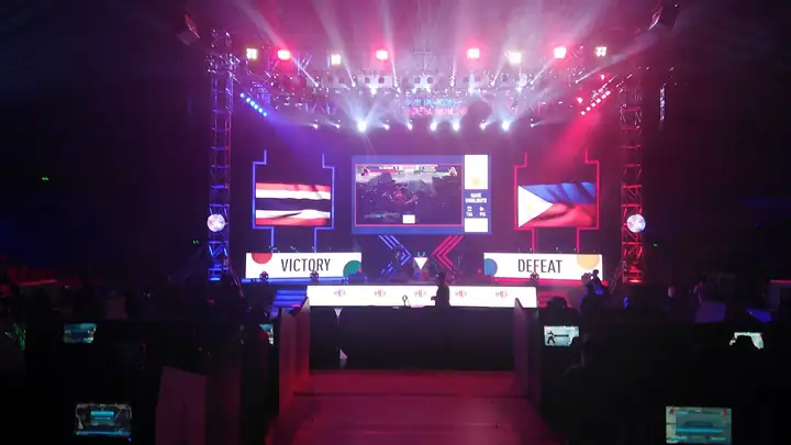 Thailand vs Philippines Tekken 7 match shown on the big screens of the 2019 SEA Games esports arena